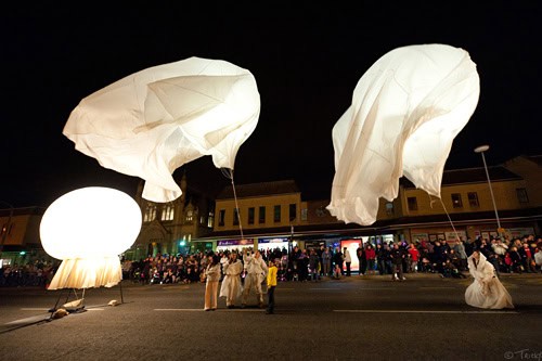 Giant helium balloons are carried aloft