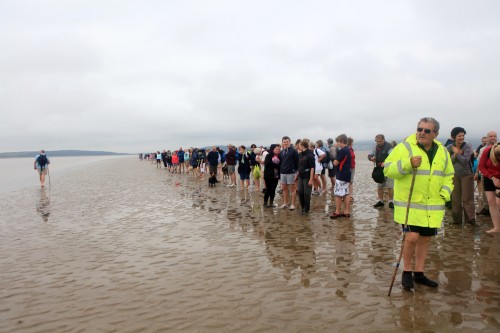 Sand Pilot - image of the cross bay walkers heading over Morecambe Bay