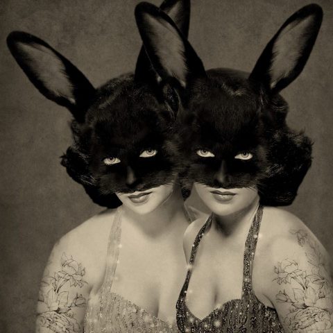 Vintage photograph of two women in rabbit masks