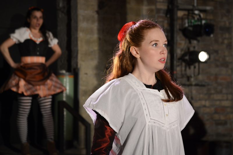 Vanessa Schofield (foreground above) is outstanding as Louisa, schoolmaster Gradgrind's dutiful daughter, as is Suzanne Ahmet (in the background) as the spirited circus girl Sissy Jupe.