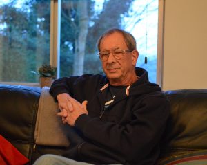Author Chris Nickson relaxing on a couch at home